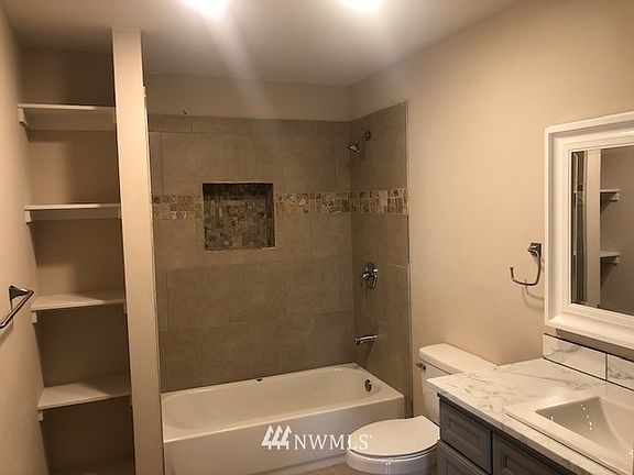 Custom kitchen upgraded cabinetry, countertops and stainless steel appliances >