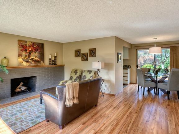 Great room feel with access to living room with fireplace and dining room for entertaining family and friends. Lots of natural light in a peaceful setting. Newly refinished hardwood flooring shines!