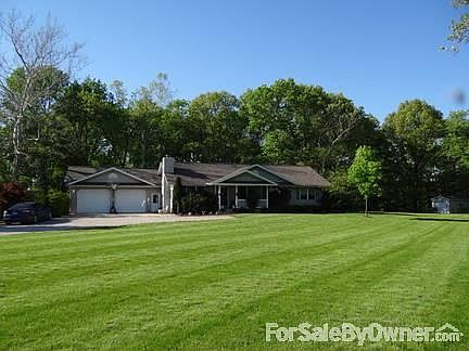 Front view of the yard and home
						:
						Beautiful yard and setting back in a pocket! New roof put on in 2011.