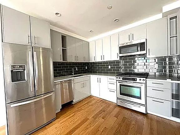 3rd image of 6334 Fresh Pond Rd APT 2F