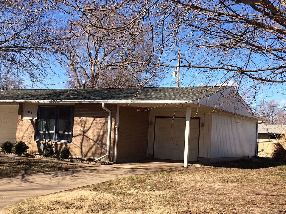 Attached garage plus covered parking