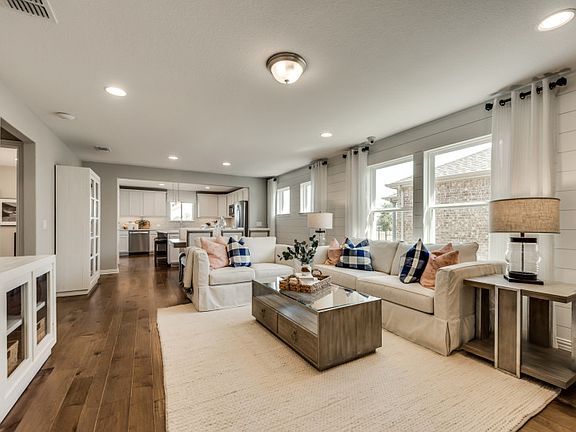 Gathering room with optional tray ceiling, open to the dining area and kitchen