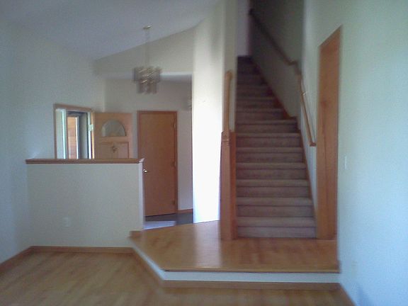 Living Room to Entry and Stairs to Upper Level