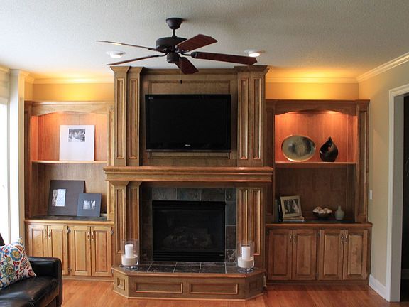 Living room with HDTV mounted above fireplace