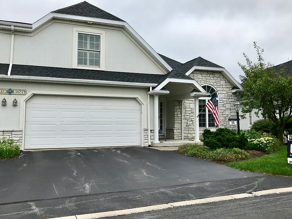 Front porch and 2-car garage