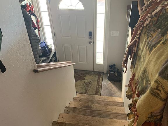 Split entry main front door. Upstairs to living room kitchen bathroom. Downstairs laundry full bath 3 bedrooms. Two hall closets. Flooring completely updated on stairs. Safety railing installed.