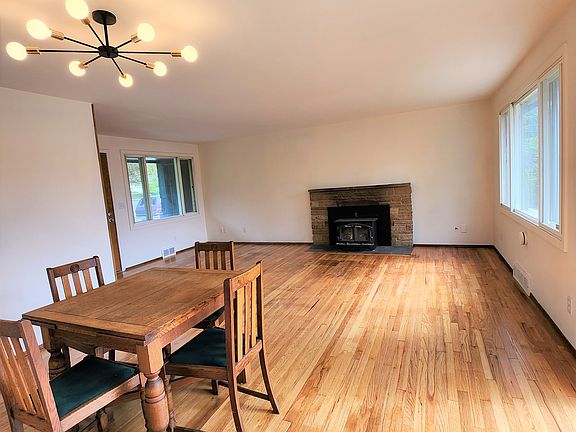 Well-maintained original hardwoods and a wide open living room. Picture windows and all windows are triple paned for energy efficiency and noise insulation.
