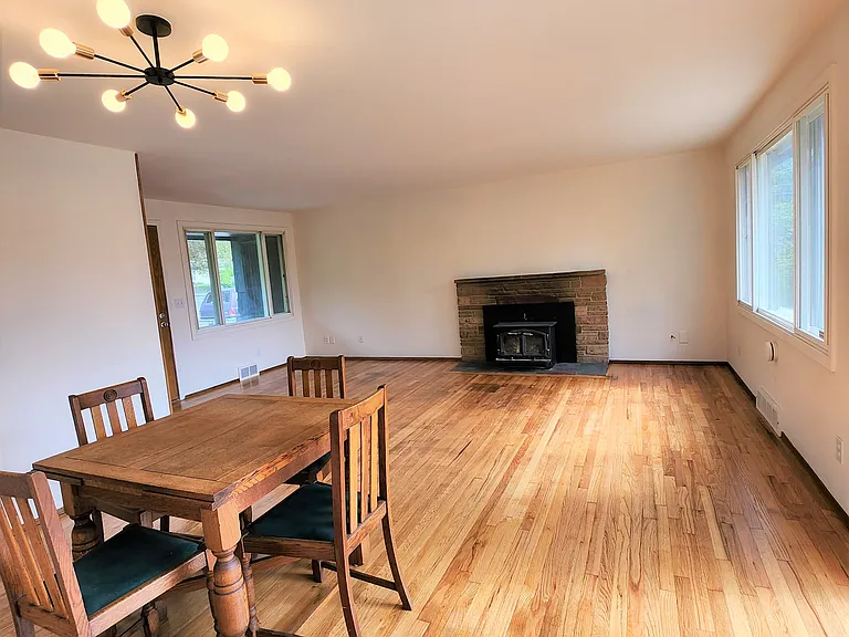 Well-maintained original hardwoods and a wide open living room. Picture windows and all windows are triple paned for energy efficiency and noise insulation.