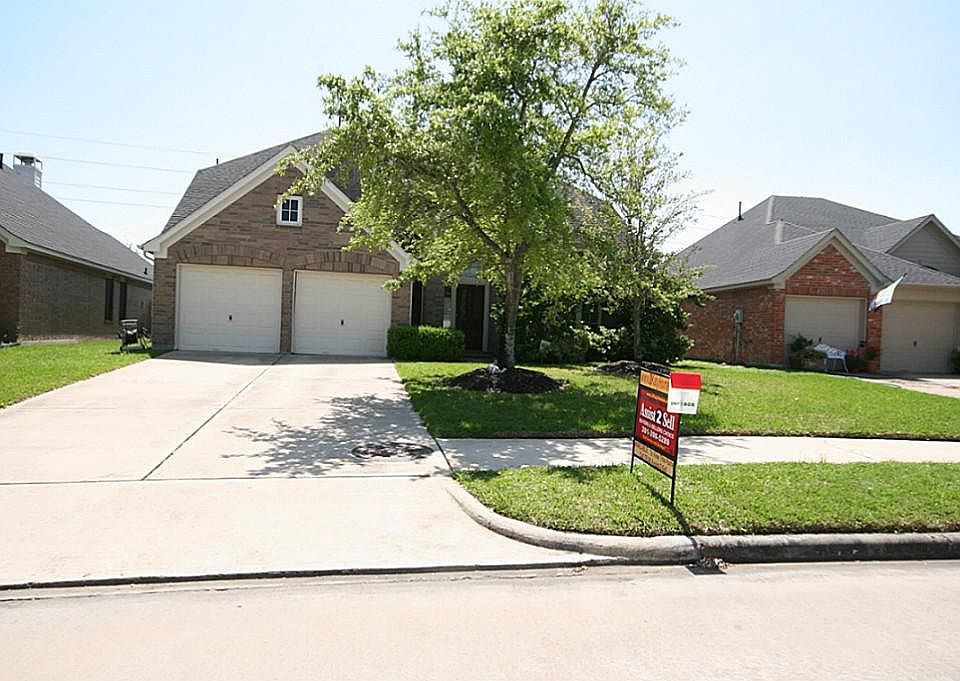  FRONT OF HOUSE - located in the master planned community of Grand Lakes, this home is located on an over sized lot that backs up to a reserve. It has no back neighbors.