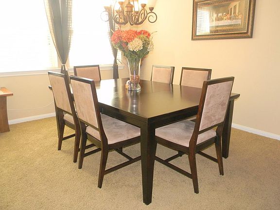 Gorgeous formal dining room with carpet flooring and lots of
