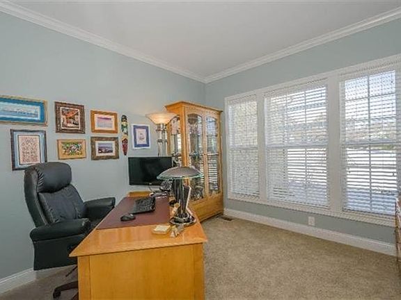 1st floor study off entry with glass pane French doors