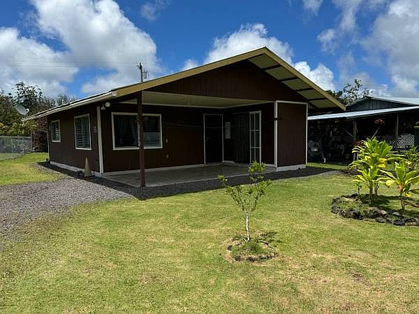 Front of home with car port