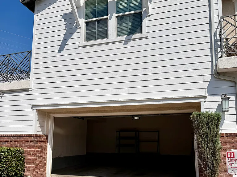 Private detached two-car garage with additional storage space.
