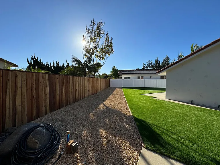 Immaculately landscaped yard with fenced in backyard. Solar panels for your utilities, RV hook up for gas and water (no sewer).
