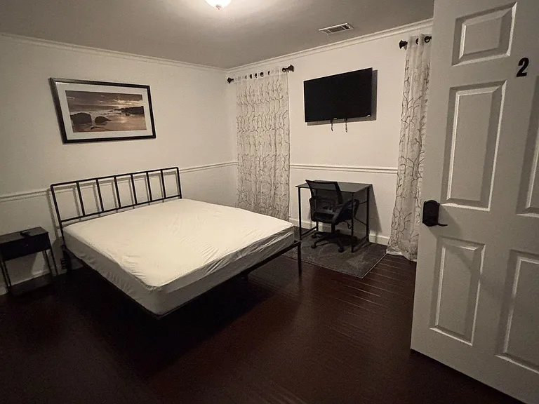 Spacious room with dresser and wardrobe