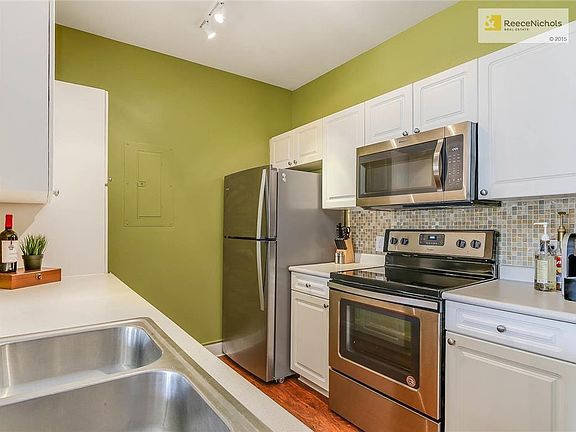 Calling all chefs!  One year old stainless steel appliances are all staying with the home.  Upgraded track lighting makes it light and bright while cooking.