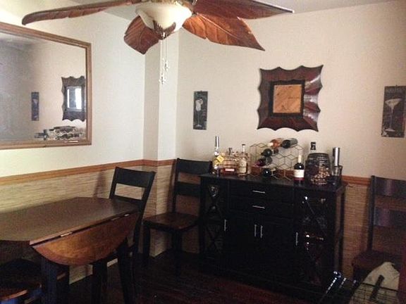 then through Privacy Door to the Classic Vintage DiningRoom with Original Finished Wood Floor