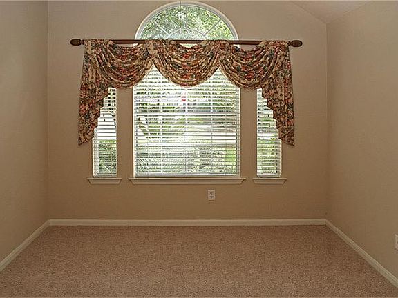 The beautiful dining room window looks out on to the lush foliage in the front yard.