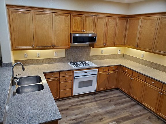 Kitchen with granite countertop.