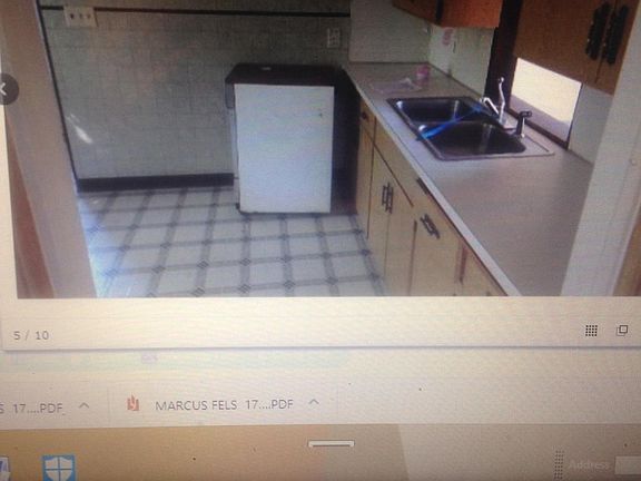 Pictures before re-hab; new plank flooring and appliances