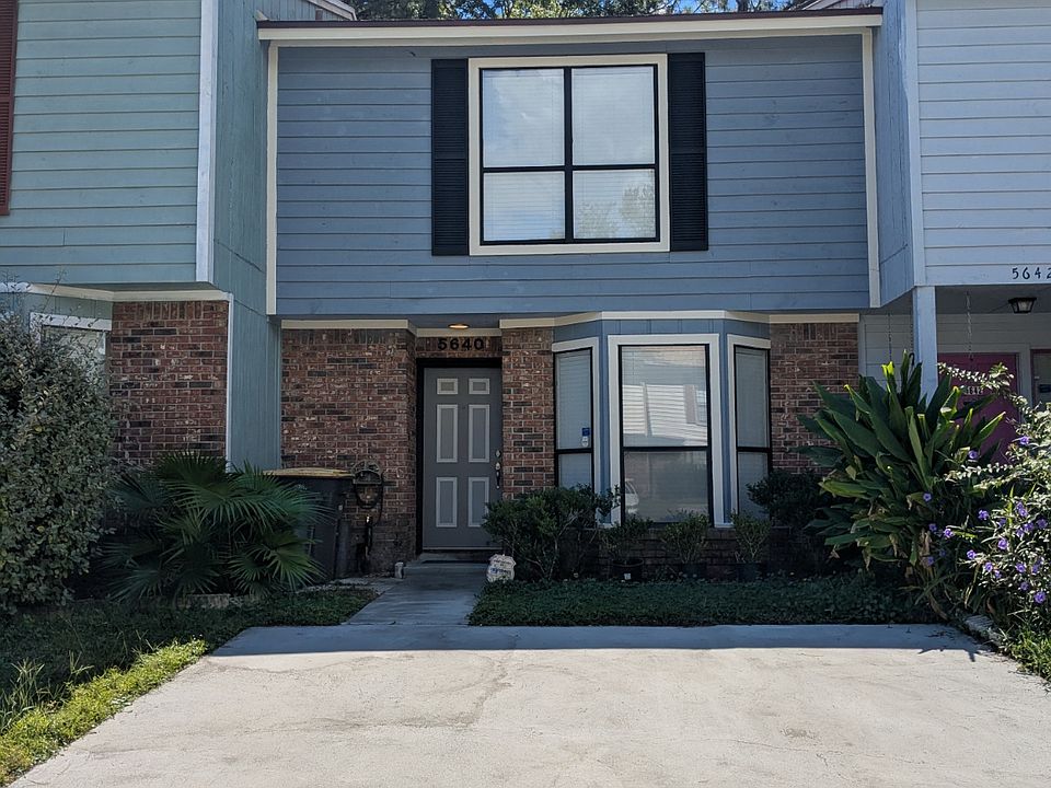 Front entrance showing two car driveway and kitchen bay windows