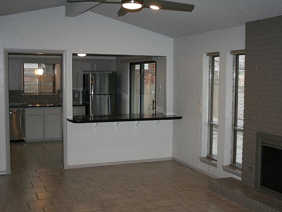 Family room looking into kitchen with granite bar