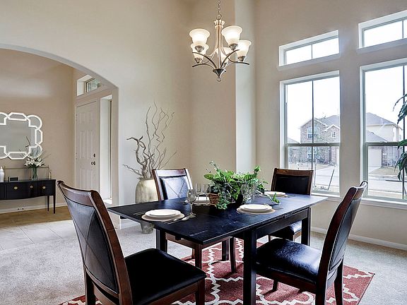 Dining room tucked off foyer