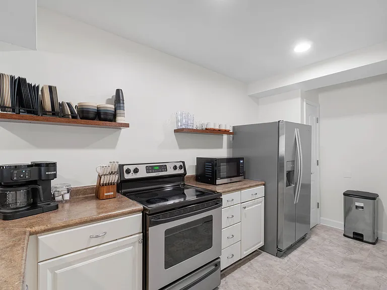 Full kitchen with Keurig, Oven, Refrigerator, Microwave and Dishwasher. Some kitchen supplies are available