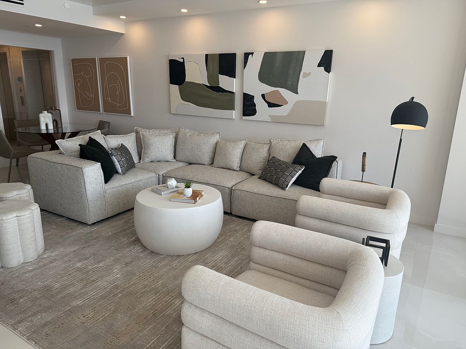 Open Living Room Looking out onto the Ocean. Beautiful sectional sofa, 2 swivel chairs and dining table with 4 chairs in the main living area.
