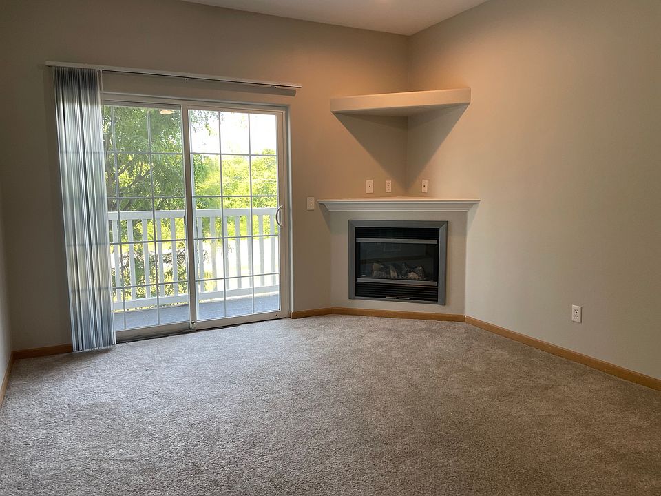 Living room area has a built-in electric fireplace