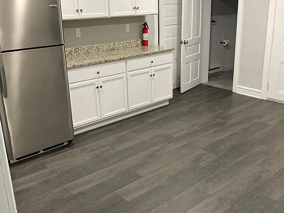 Large, recently remodeled kitchen with updated cabinets, granite counters, and stainless steel appliances