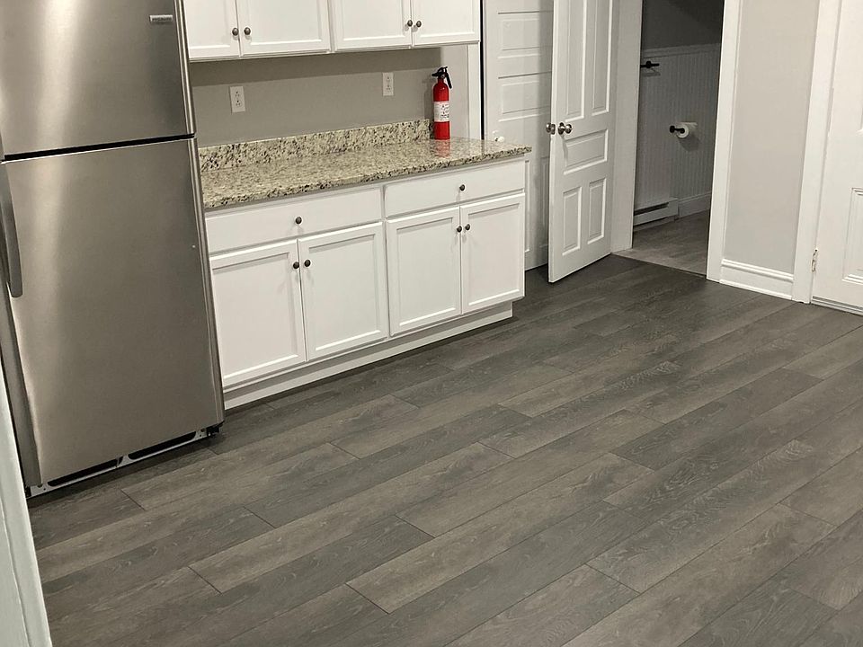 Large, recently remodeled kitchen with updated cabinets, granite counters, and stainless steel appliances