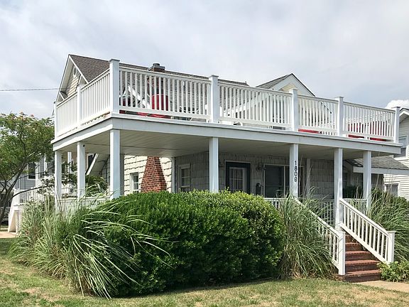 corner lot with hedges for porch privacy.