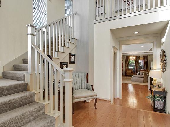 Step into the 2-story entry and note the fresh paint, hardwood floors and wonderful woodwork.