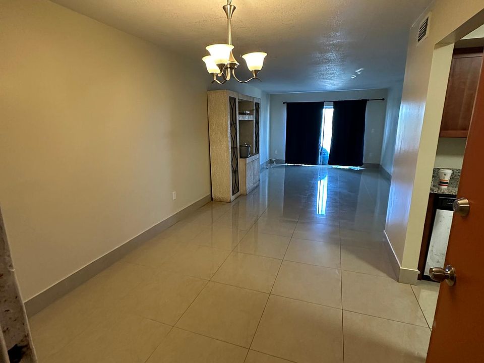 Front Entrance looking into Dining & Living Room with Kitchen Entrance on the Right