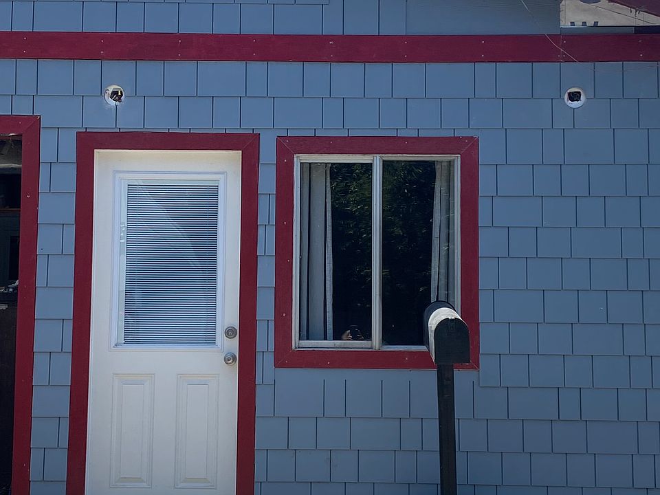 Front entrance and parking space.