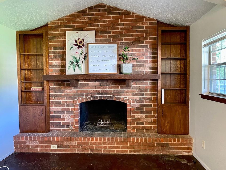 One end of open living has built in bookcases.