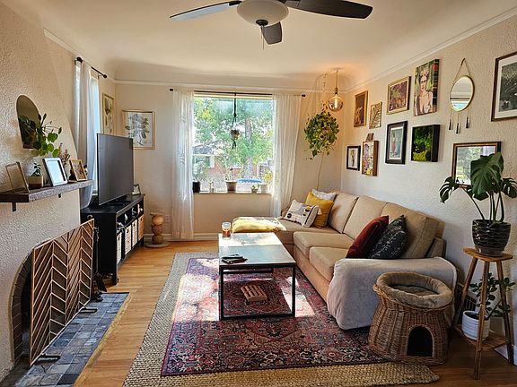 Living room: tons of natural light with three windows including one 4x4 window facing west with partial mountain views.