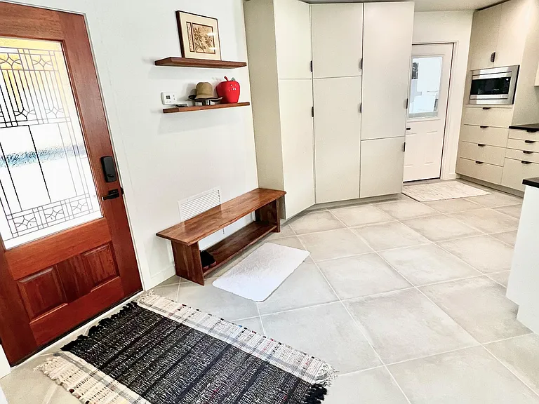 Partial view of of kitchen and front entrance