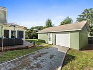 Backyard and detached garage at 123 Serenade Lane
