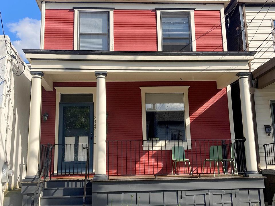 The front porch is large enough for a small table and chairs.