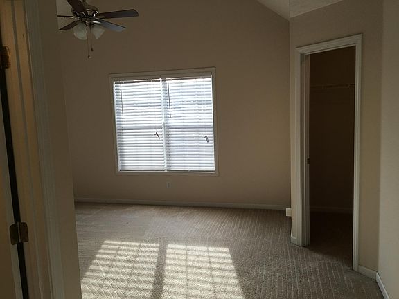 master bedroom with walk-in closet