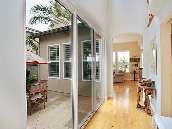 As you move toward the back of the home you pass courtyard.