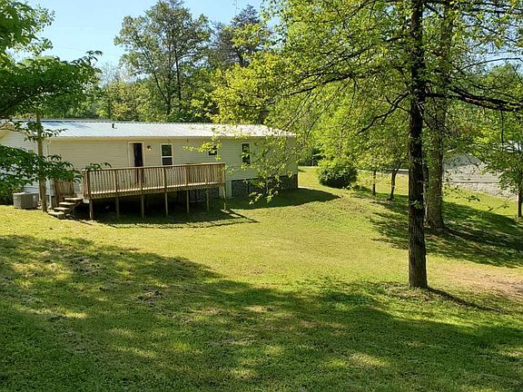 Picture of the back deck and part of the backyard. Deck is ~12'x24'