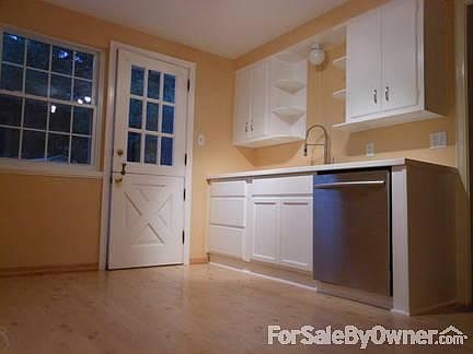 galley kitchen view from garage entry
						:
						stainless sink& dishwasher, GFI, 220 stove elec + GAS hookups