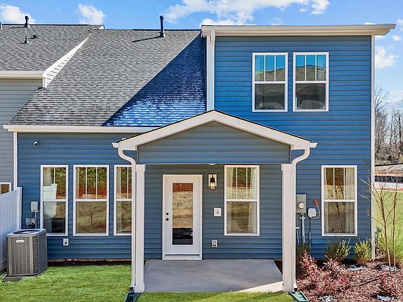 Exclusive end-unit townhome in Aspen Ridge with elegant design and high standards