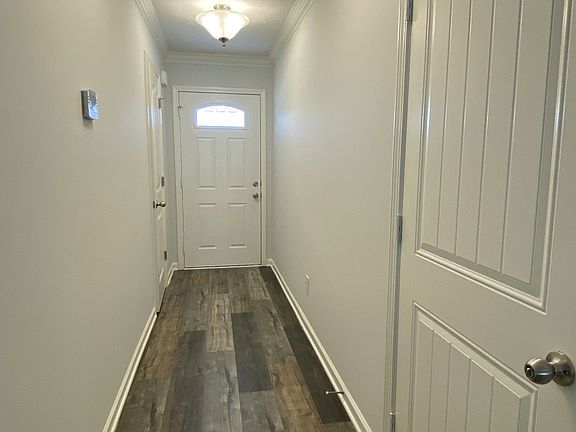Private entrance from covered front porch and 2 car garage