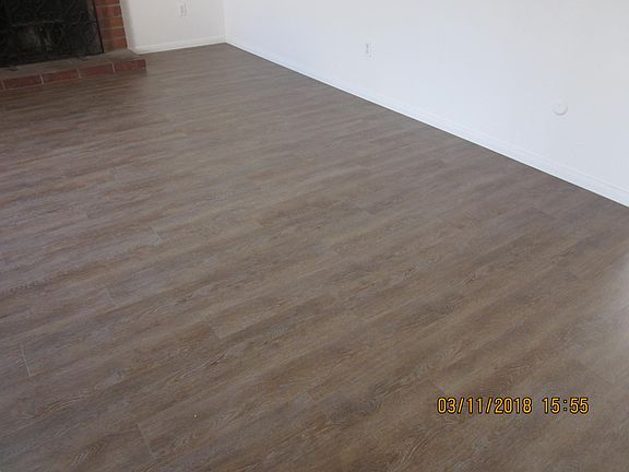 Flooring in baths, kitchen, hall and livingroom