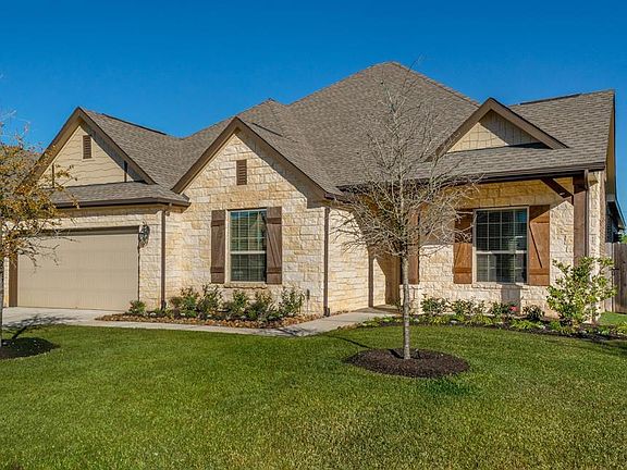 The stone and wood elevation of this beautiful home draws you in. Take a look. The inside is just as impressive as the exterior.
