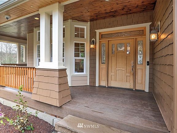 Charming covered porch with newly painted exterior. 
